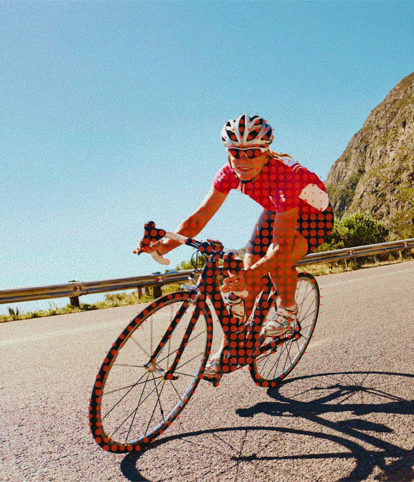 A cyclist checking his bike